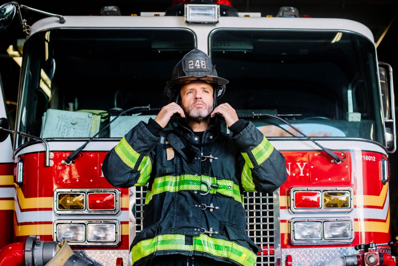 Usa New York Portrait Of Firefighter Putting On 2022 12 16 22 31 29 Utc 1 1536x1025 
