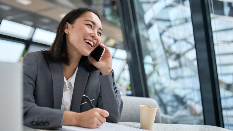 Cheerful woman during a phone interview
